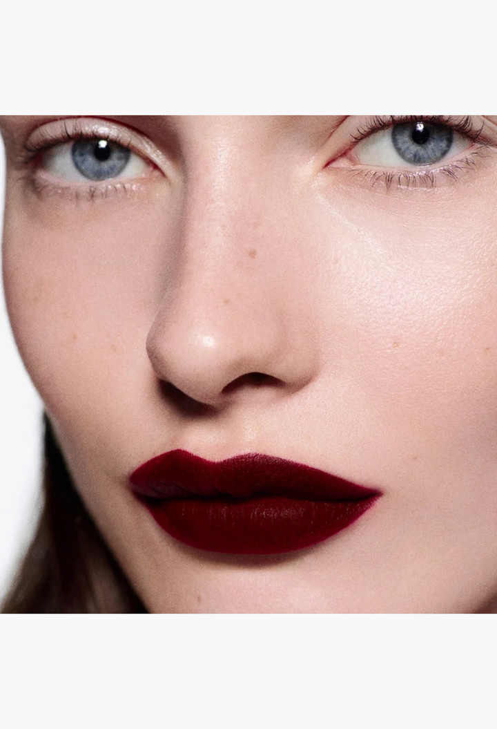 GLAM MODA Rouge Victoria matte lipstick applied to model lips with a soft blurred finish and natural skin texture