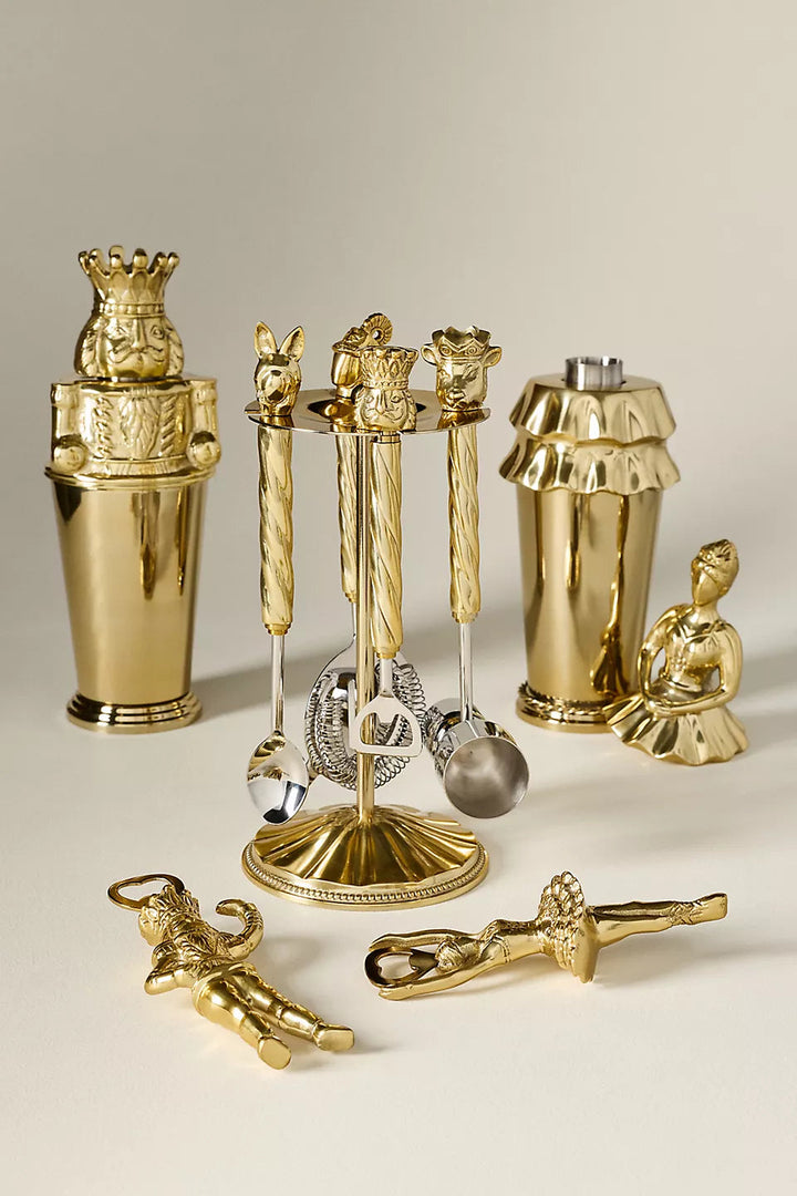 GLAM MODA Nutcracker-themed barware collection featuring gold-toned stainless steel shakers and ballet-inspired tools.