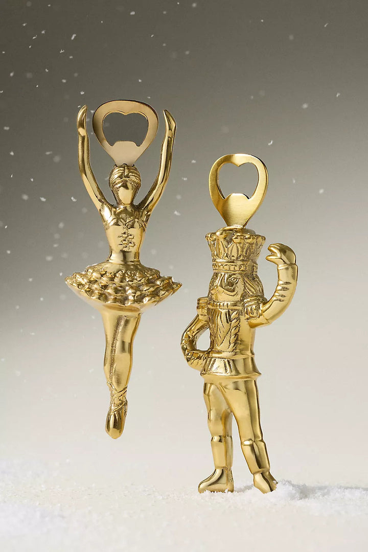 GLAM MODA gold-toned stainless steel Sugar Plum Fairy and Nutcracker bottle openers with ornate sculptural details.