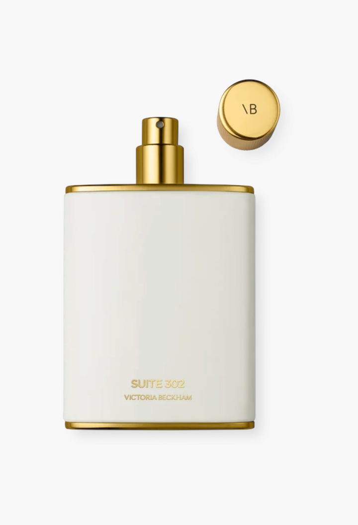 GLAM MODA Suite 302 Eau de Parfum in a white enamel bottle with gold accents and a matching gold cap.
