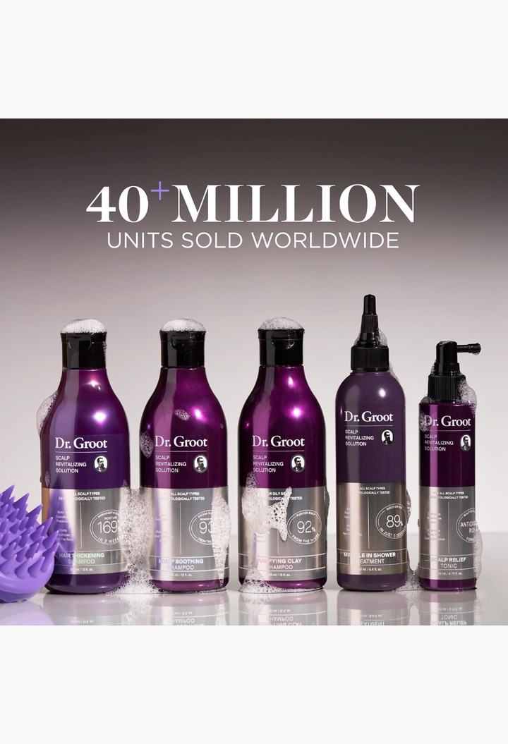 GLAM MODA Dr. Groot scalp revitalizing shampoo and treatment set in purple bottles with a purple scalp massager