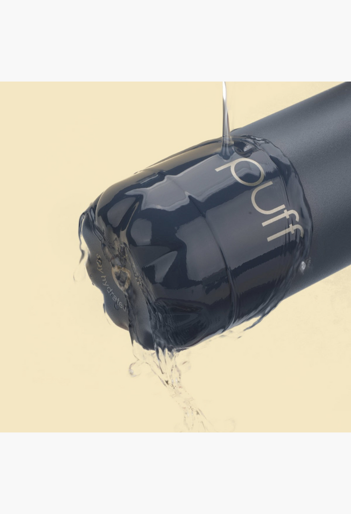 GLAM MODA matte Mykonos blue Puff stainless steel water bottle with liquid dripping from the cap