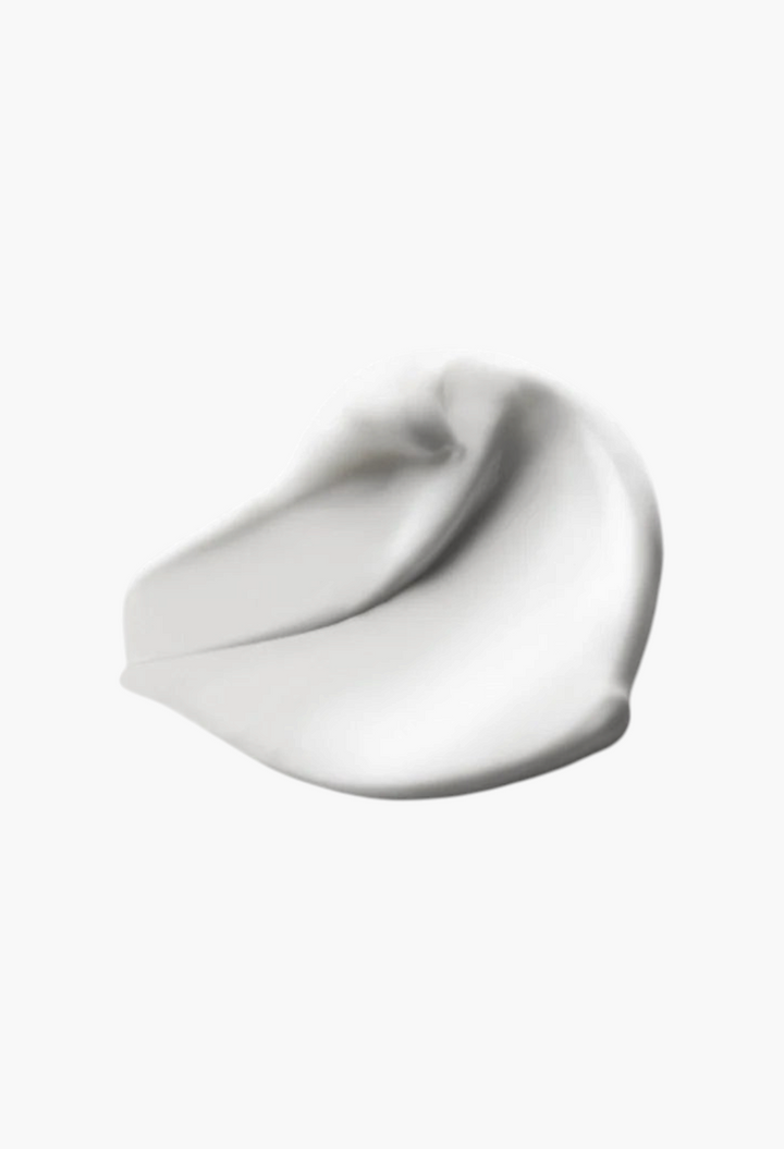 A smooth white cream swatch of GLAM MODA Portofino '97 Body Lotion, showing a rich and nourishing texture.