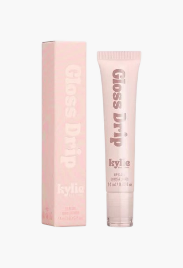 GLAM MODA Kylie by Kylie Jenner Gloss Drip lipgloss in a light pink squeeze tube with matching product box
