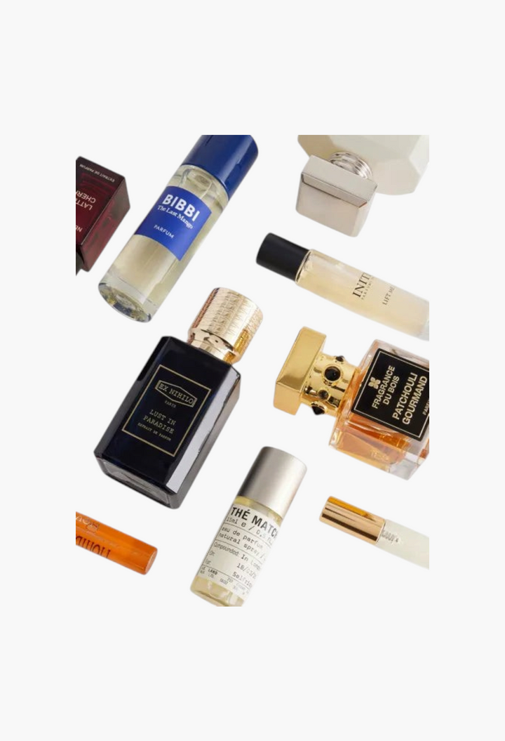 GLAM MODA Fragrance Advent Calendar 2026 featuring a collection of luxury perfume bottles from various designer brands.