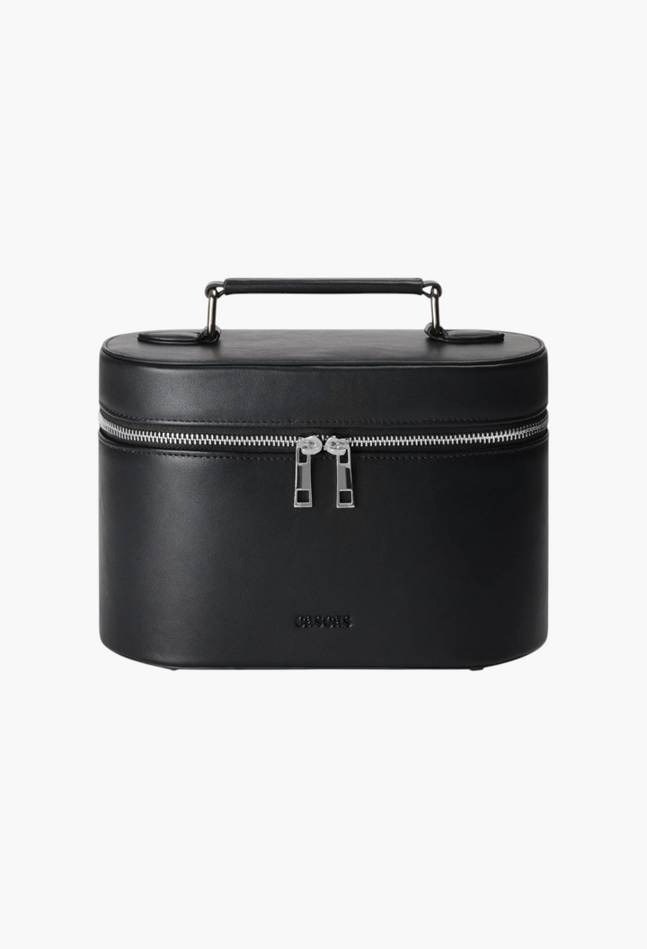 GLAM MODA oval makeup vanity case in espresso brown vegan leather with silver hardware and a top carry handle.