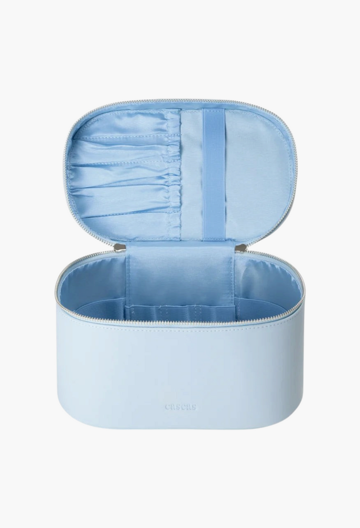 GLAM MODA open oval vanity case in light blue vegan leather with silver hardware and interior brush organizers