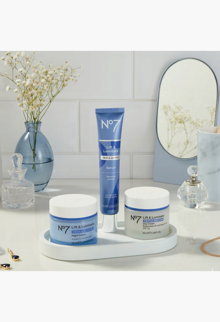 GLAM MODA No7 Lift & Luminate 3-piece skincare set featuring serum, day cream with SPF 30, and night cream on a tray.