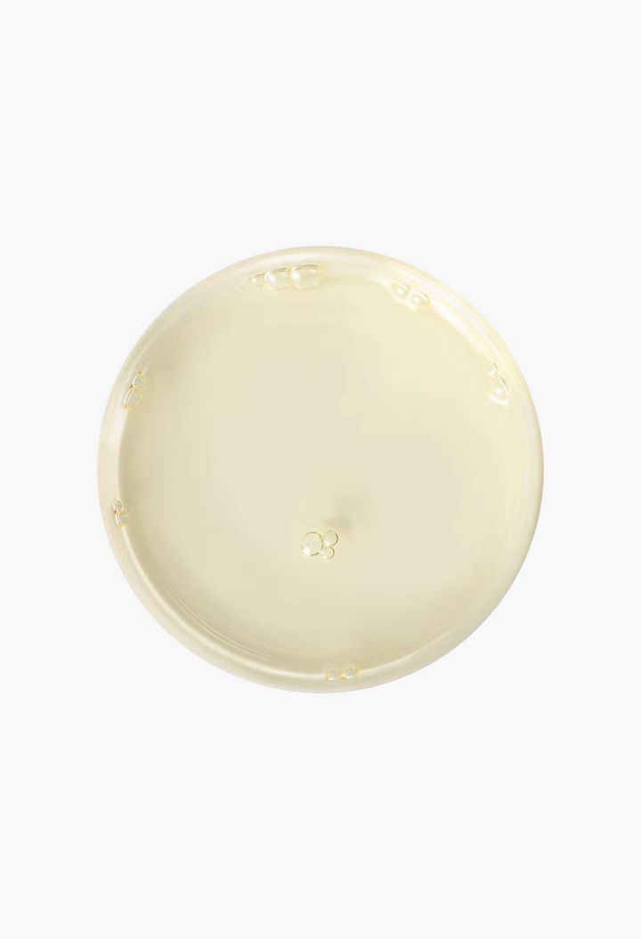 GLAM MODA Christophe Robin Perfecting Radiance Oil with Amla Oil, a clear golden hair treatment oil texture.