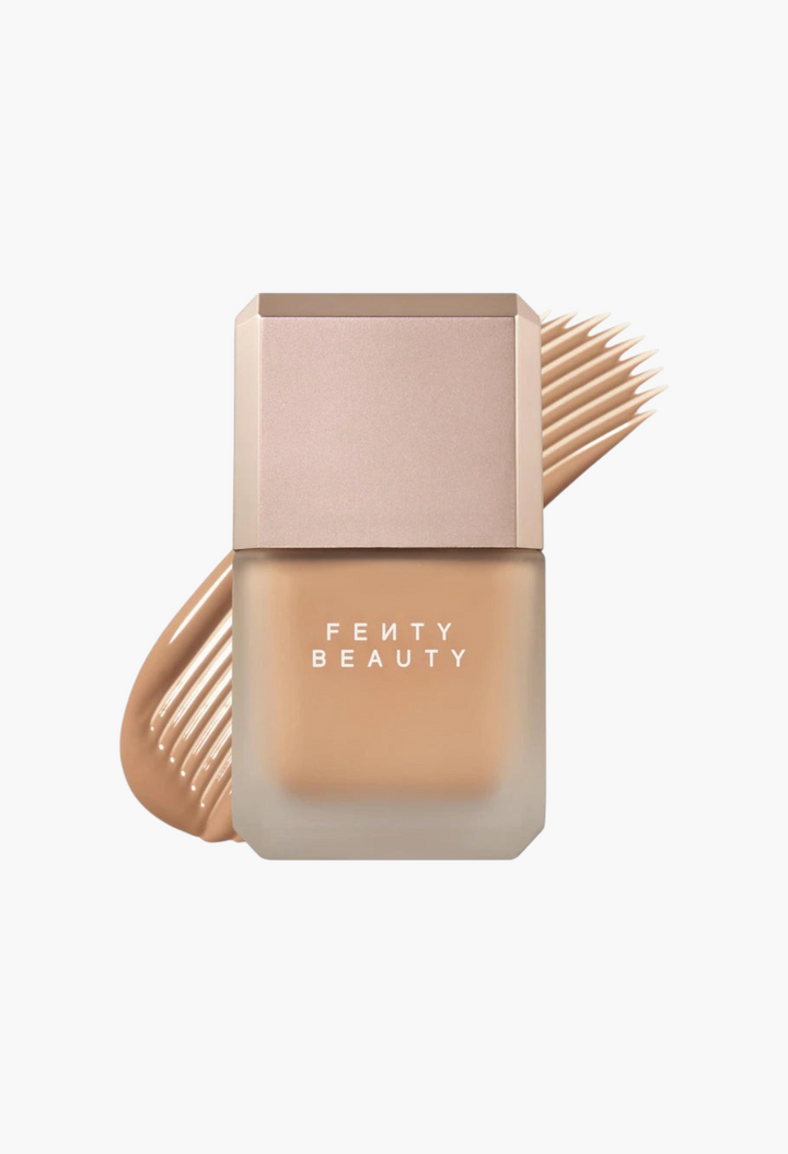 GLAM MODA Fenty Beauty Pro Filt'r liquid foundation in a frosted glass bottle with a beige cap and foundation swatch.