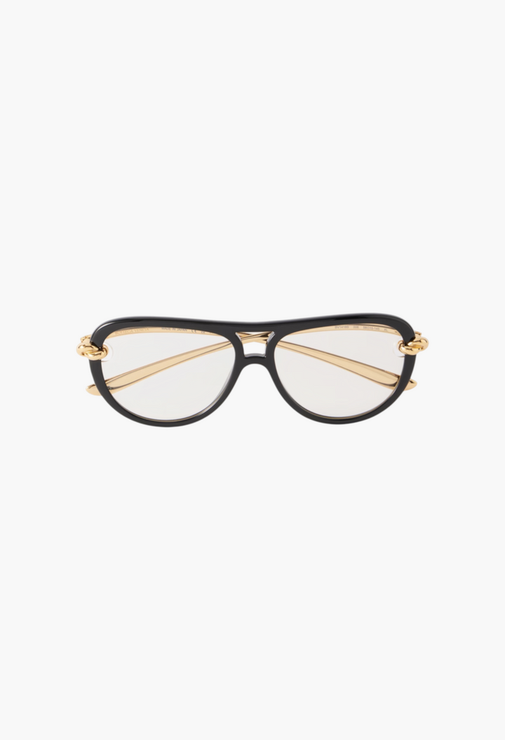 GLAM MODA Bottega Veneta New Knot aviator sunglasses with black frames and gold-tone twisted metal temple details.
